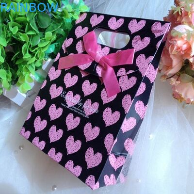 Sacchi di carta su misura personali con la maniglia per il Natale