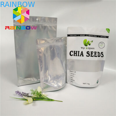 Il di alluminio all'ingrosso del commestibile sta sulla borsa a chiusura lampo con la chiara finestra anteriore per i semi/imballaggio della frutta secca