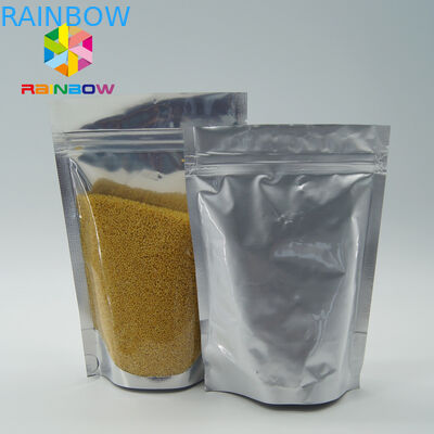 Il di alluminio all'ingrosso del commestibile sta sulla borsa a chiusura lampo con la chiara finestra anteriore per i semi/imballaggio della frutta secca