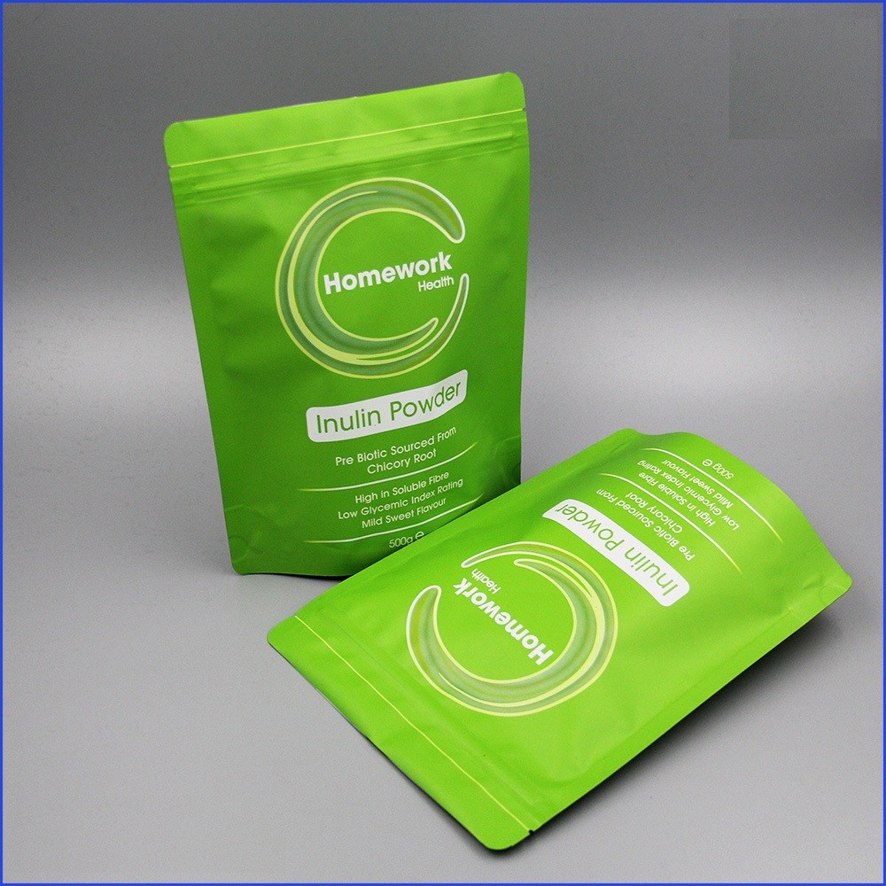 Le borse di caffè riutilizzabili dello zip la stagnola della valvola che ha allineato stanno sul sacchetto d'imballaggio del caffè/tè/polvere