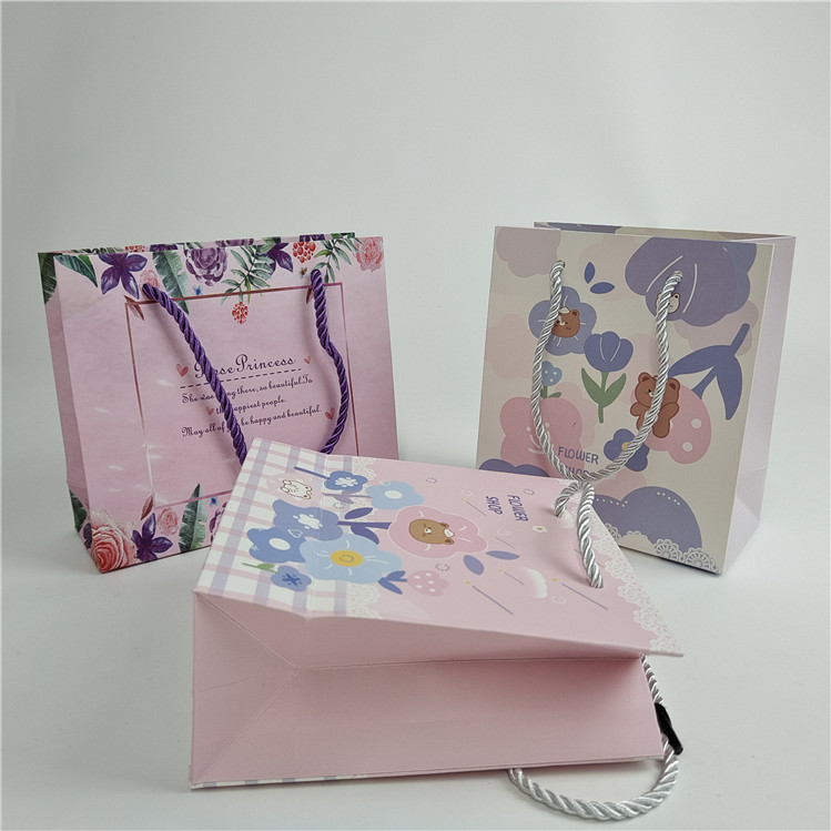 Assicurazione della qualità promozionale Impronta digitale personalizzata Logo stampato imballaggio sacchetti di carta