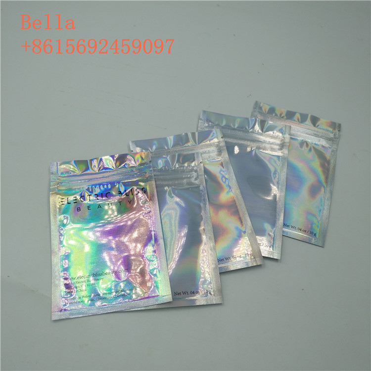 Il sacchetto laterale della stagnola della guarnizione tre che imballa, piccolo cosmetico sta sulle borse con la chiusura lampo