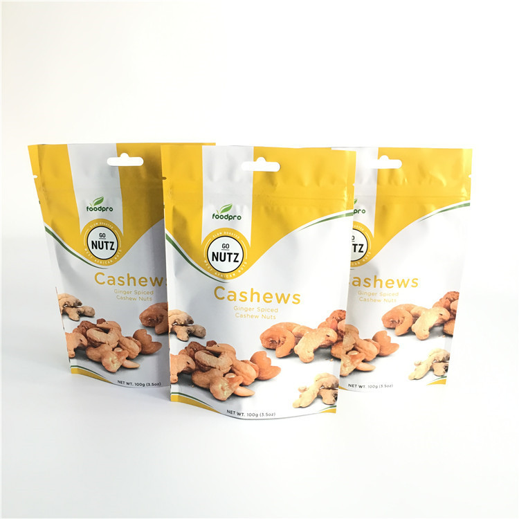 L'imballaggio su ordinazione dei sacchetti di plastica di stampa sta sulla borsa della chiusura lampo con una valvola di degassamento di modo